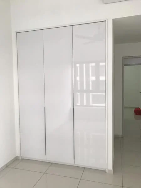 Room features: white glossy built-in wardrobe, sliding doors, neutral wall colour, tile flooring, ceiling fan, natural light from adjacent room; style: modern.