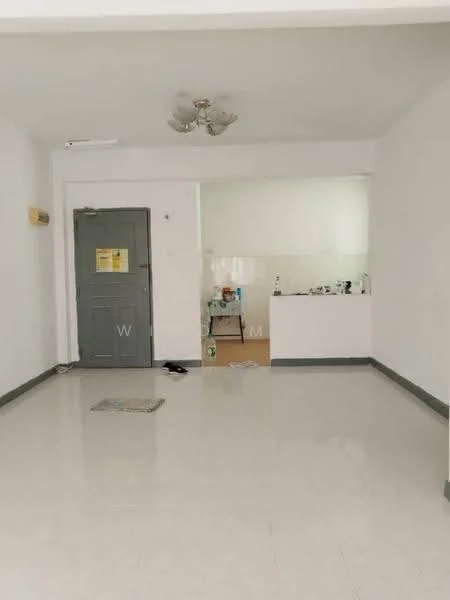 Living features: white painted walls, polished ceramic tile flooring, ceiling fan with light, main entrance door, door with grey finish, open layout to kitchen, light-colored baseboards, no visible furniture. Kitchen features: white tiled backsplash, kitchen countertop, no visible appliances, open layout to living area.
