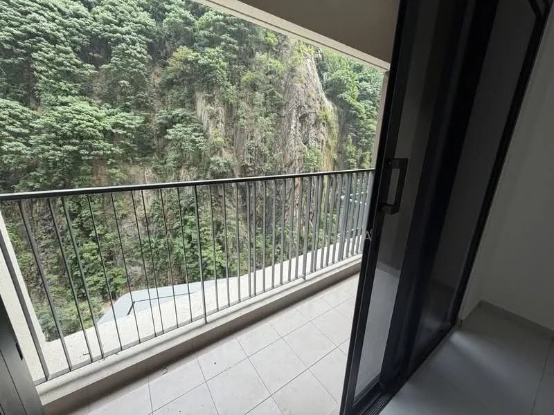 Room features: balcony, metal railing, tile flooring, sliding glass door, view of greenery, concrete wall, floor-to-ceiling windows; view: mountain.