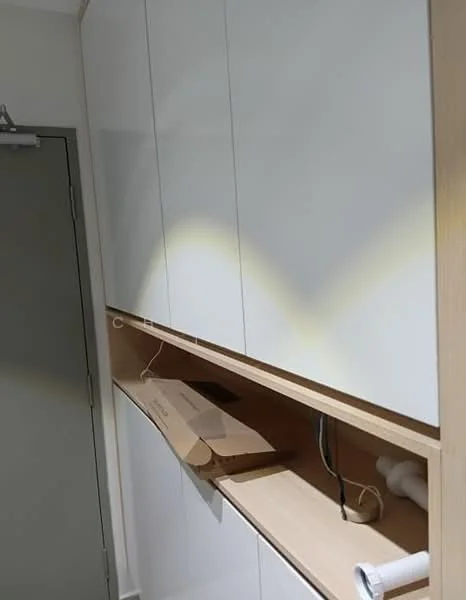 Room features: white cabinetry, wooden shelving, built-in storage, cable management, neutral wall colour, door with metal frame, light fixture, flooring not visible; style: modern.