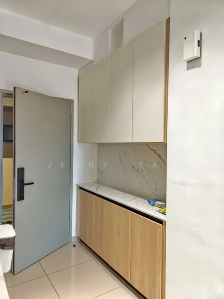 Room features: light grey painted walls, white marble backsplash, wood cabinetry with light wood finish, white countertop, floor tiles in cream, single door with handle, wall-mounted switch, built-in storage cabinets; style: modern.