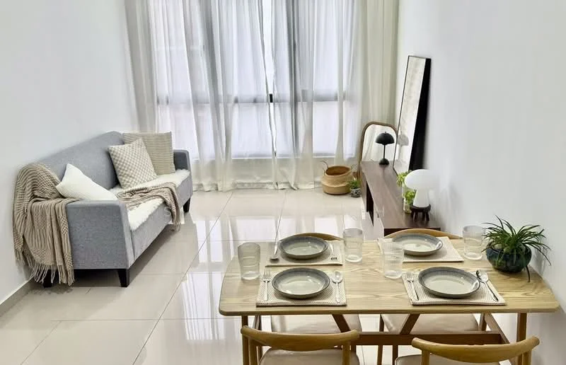Living features: grey fabric sofa, throw blanket on sofa, decorative cushions on sofa, wooden dining table, four wooden dining chairs, set of plates on table, set of glasses on table, green plant on table, wooden console table, table lamp on console, large windows with sheer curtains, glossy tiled flooring, neutral painted walls; style: modern.