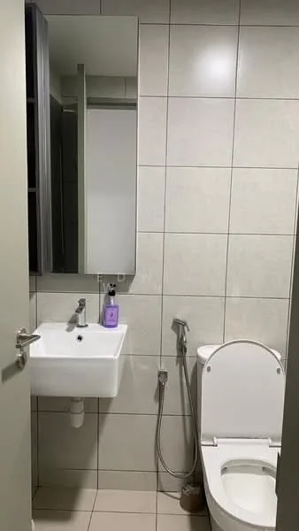 Bathroom features: white ceramic wall tiles, light grey floor tiles, single-bowl ceramic sink, chrome basin mixer faucet, framed mirror, one-piece toilet, bidet spray, wall-mounted storage cabinet; style: modern.