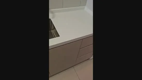 Kitchen features: white countertop, stainless-steel sink, built-in cabinetry with drawers, smooth surface, tile backsplash, neutral cabinetry colour, modern design, under-mounted sink; style: modern.
