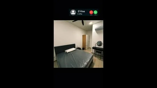 Bedroom features: queen-size bed with mattress, grey bed frame, white painted walls, ceiling fan, wall-mounted split AC, tile flooring, study desk with chair, wooden door, window with no visible treatment.