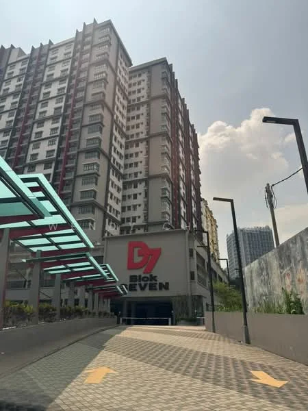 Exterior type: high-rise condominium; features: multi-storey building, red and white facade, glass canopy entrance, paved driveway, visible signage, surrounding greenery, urban context, adjacent buildings in background; style: modern.