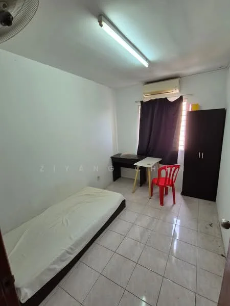 Bedroom features: single bed with mattress, white painted walls, white tiled flooring, ceiling fan, window with black curtain, study desk, black cabinet, red plastic chair, light fixture with fluorescent tube; style: minimalist.