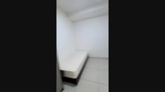 Room features: white painted walls, tile flooring, single bed frame without mattress, built-in wardrobe, ceiling light.