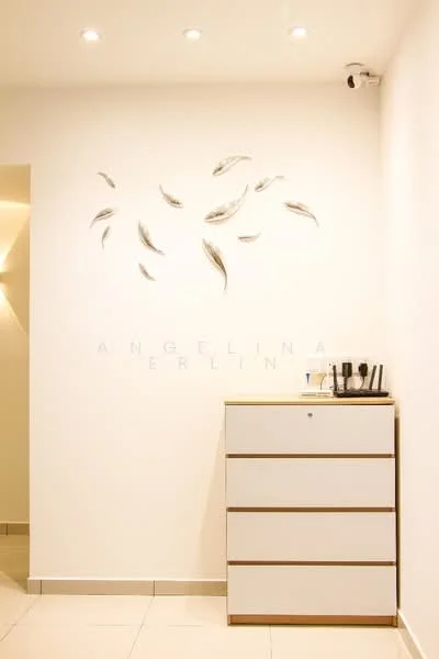 Room features: white painted walls, decorative wall art, tile flooring, ceiling lights, drawer cabinet with white finish, minimalist decor; style: modern.