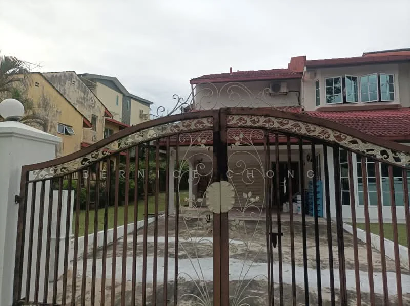 Exterior type: detached bungalow; features: gated entrance with decorative iron gate, manicured lawn, paved driveway, two-storey building, red tiled roof, large windows, surrounding greenery, exterior wall with light color finish; style: modern.