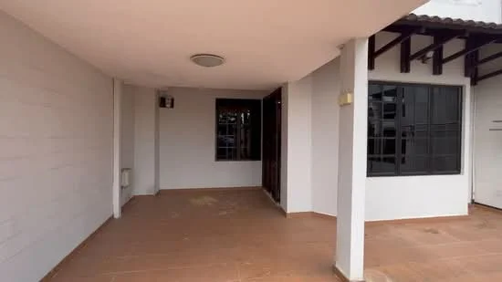 Room features: white painted walls, terracotta tile flooring, ceiling light fixture, large windows, sliding glass door, exposed beams, air conditioning unit; style: modern.