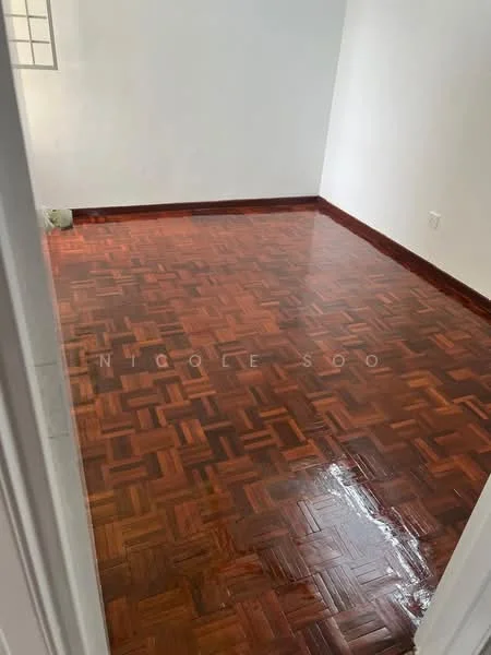Room features: parquet wood flooring, white painted walls, natural light from window, baseboards, door frame, clean and polished floor.