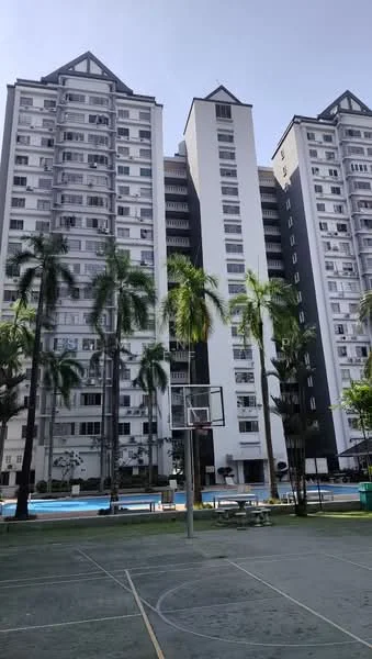Exterior type: high-rise condominium; features: tall residential buildings, basketball court, swimming pool visible, palm trees, manicured landscaping, modern architectural design, multiple balconies, glass windows, white and grey facade, outdoor recreational area; style: modern.