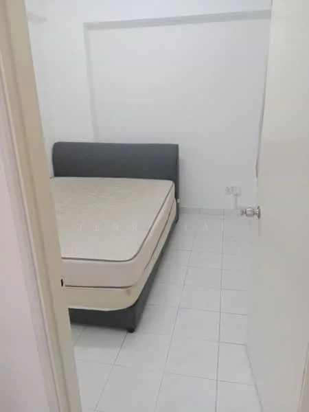 Room features: white painted walls, white tiled flooring, single bed frame, mattress on bed frame, door leading to room, light switch on wall.