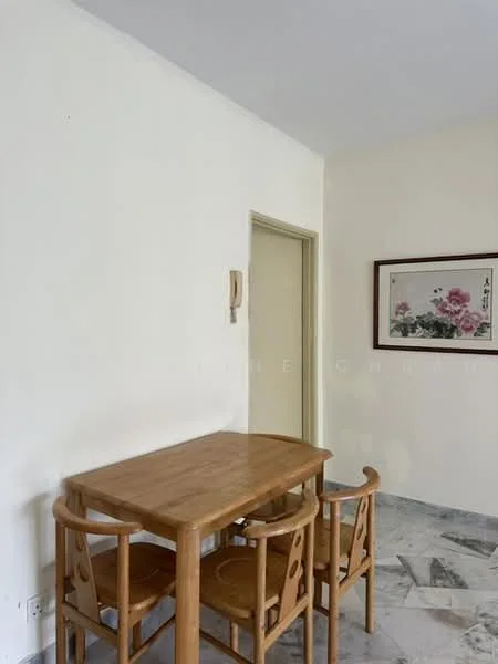 Dining features: wooden dining table, 4 wooden chairs, marble flooring, white painted walls, framed artwork on wall, doorway leading to another room.