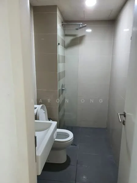 Bathroom features: white toilet, shower with glass enclosure, chrome shower head, grey tile flooring, beige tiled walls, recessed ceiling lights, mirror above sink, single-sink vanity with cabinet; style: modern.