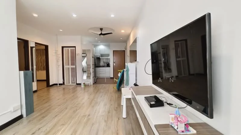 Living features: laminate flooring, white painted walls, 5-blade ceiling fan with light, wall-mounted TV, TV console, recessed downlights, open layout, decorative wall clock, area rug, decorative plant, large windows, doorway leading to kitchen, doorway leading to hallway; style: modern. Kitchen features: white cabinetry, stainless-steel fridge, built-in oven, 4-burner gas hob, single-bowl stainless-steel sink, chrome pull-down faucet, tile backsplash, open layout to living area; style: modern.