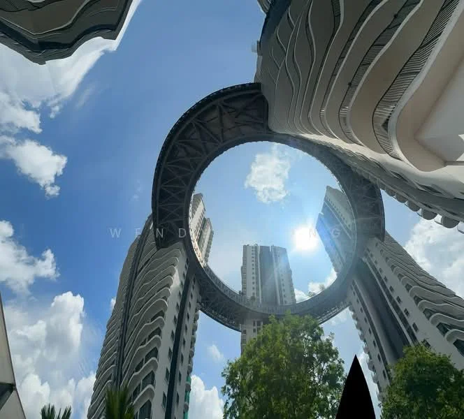 Exterior type: high-rise condominium; features: circular architectural feature, glass facade, surrounding high-rise buildings, open sky view, modern design, green landscaping at base; style: modern.