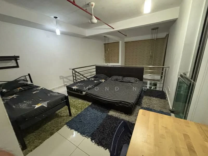 Bedroom features: two beds, black metal bed frame, striped bedding, star-patterned bedding, area rug with geometric pattern, white painted walls, ceiling fan, large windows with blinds, glass balcony railing, wooden table, chair; style: modern.