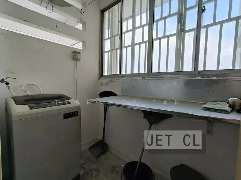 Laundry features: top-load washing machine, white walls, grey concrete flooring, window with multiple panes, metal countertop, two bar stools, exposed electrical outlet, shelving above countertop.