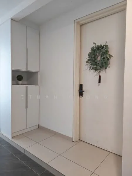 Room features: white painted walls, grey floor tiles, white cabinetry, decorative wall wreath, small potted plant, door with black handle, tile flooring, built-in storage; style: modern.