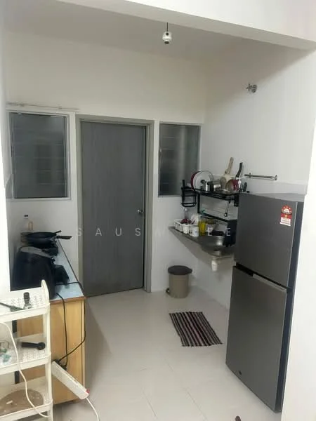Kitchen features: white painted walls, ceramic tile flooring, single-bowl stainless-steel sink, chrome pull-down faucet, grey cabinetry, built-in shelf, stainless-steel fridge, kitchen countertop, window with glass panes, door to another room, small trash bin, kitchen mat; style: modern.