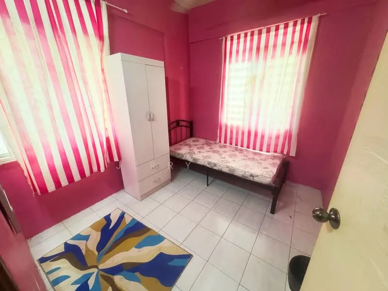 Bedroom features: pink painted walls, white tiled flooring, single bed with mattress, white wardrobe with two doors, striped curtains in red and white, area rug with abstract pattern, window with natural light.