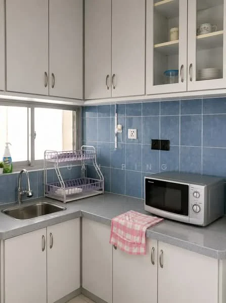 Kitchen features: single-bowl stainless-steel sink, chrome pull-down faucet, blue tiled backsplash, grey laminate countertop, white shaker cabinets, microwave, dish rack, pink checkered dish towel, window with white frame, light-colored flooring, electrical outlets, under-cabinet lighting; style: modern.