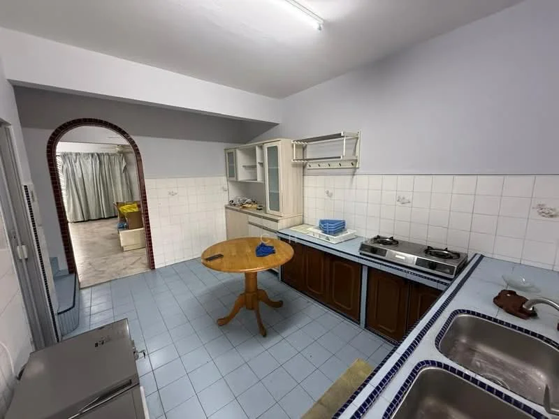 Kitchen features: blue tiled flooring, white tiled walls, wood cabinetry, double-bowl stainless-steel sink, chrome pull-down faucet, 4-burner gas hob, kitchen countertop, round wooden dining table, refrigerator, open shelving, curtains, light fixture.
