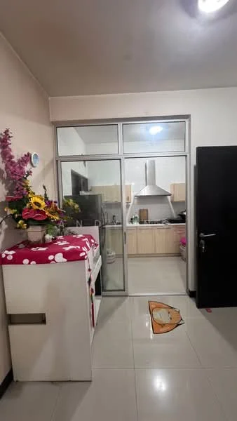 Kitchen features: white cabinetry, stainless-steel range hood, built-in oven, freestanding fridge, ceramic tile flooring, glass sliding door, countertop with space for appliances, decorative flowers on countertop; style: modern. Room features: white walls, recessed lighting, decorative wall art, floor mat.