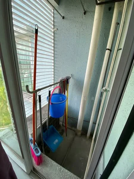 Laundry features: sliding glass door, blue bucket, red mop, broom, cleaning supplies, grey walls, concrete flooring, exposed pipes.