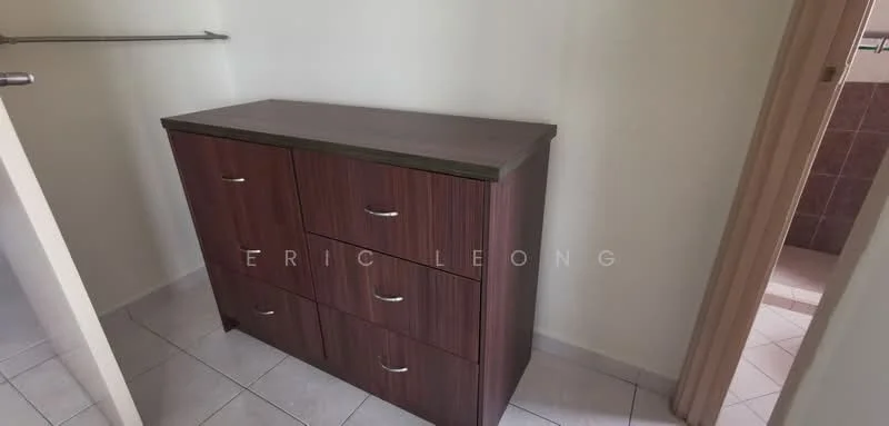 Room features: wooden dresser with five drawers, white walls, tile flooring, doorway leading to another room.