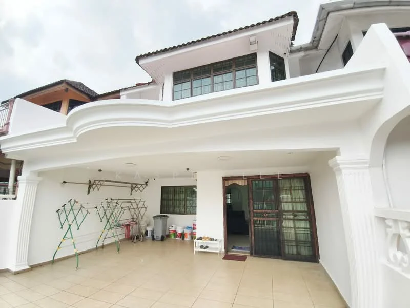 Exterior type: detached bungalow; features: white painted facade, flat roof, covered porch, tiled flooring, large windows, double main entrance door, laundry drying rack, outdoor storage area, manicured landscaping, exterior wall with decorative columns; style: modern.