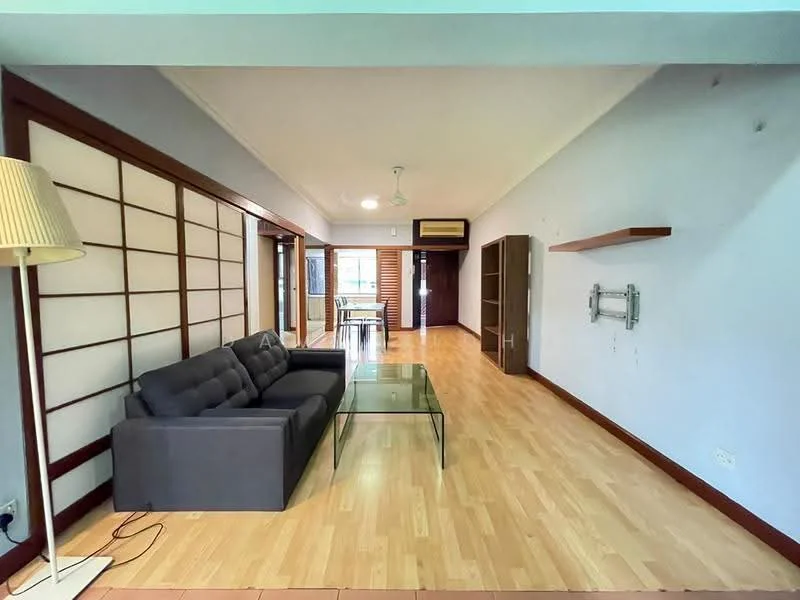 Living features: grey fabric sofa, glass coffee table, wooden flooring, white painted walls, sliding shoji screens, recessed ceiling lights, air conditioning unit, wall-mounted TV bracket, dining table visible in background; style: modern.
