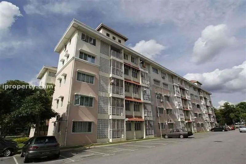 Exterior type: low-rise apartment block; features: pink painted facade, balconies with metal railings, multiple storeys, parking lot in front, surrounded by greenery, cloudy sky, windows with grilles; style: modern.
