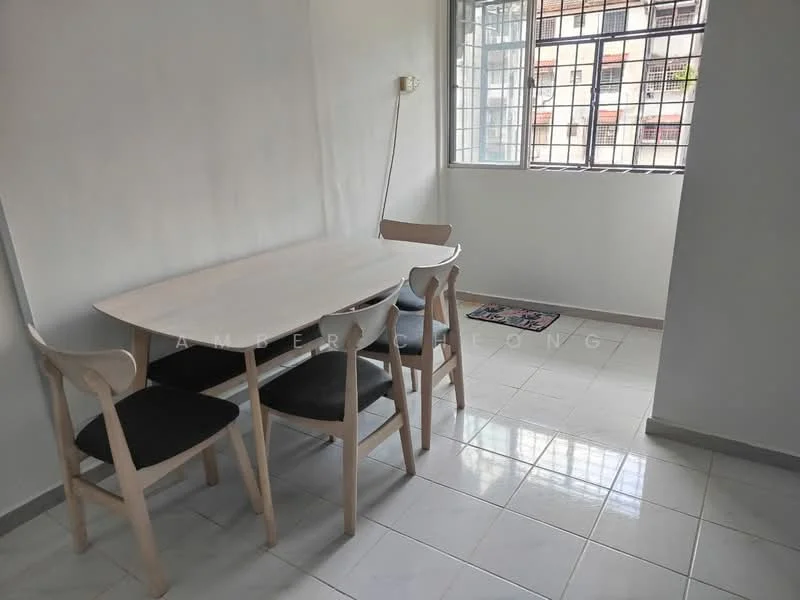 Dining features: white dining table, 4 wooden dining chairs with black cushions, white painted walls, glossy white tile flooring, large window with metal grille, natural light from window, small mat on floor; style: modern.
