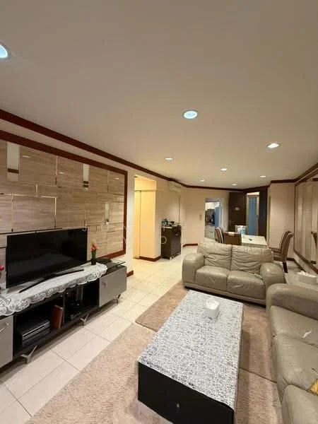 Living features: cream leather sofa, 2-seater leather sofa, coffee table with marble top, TV console, wall-mounted TV, area rug, recessed downlights, cream painted walls, tile flooring, decorative wall paneling, dining area visible in background, open layout; style: modern.