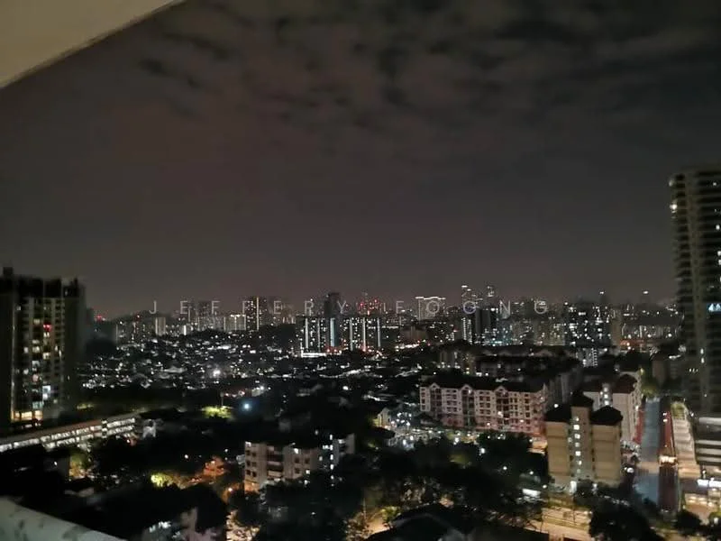 Exterior type: high-rise condominium; features: city skyline view, night lighting, surrounded by urban landscape, multiple high-rise buildings, low-rise residential buildings, street view with illuminated roads; style: modern.