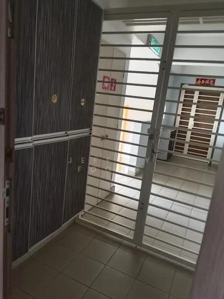 Room features: sliding security gate, grey tiled flooring, wooden cabinetry with horizontal lines, white walls, door with handle, light source from outside, storage lockers, interior hallway; style: modern.