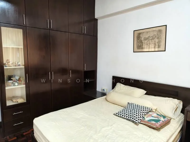 Bedroom features: queen-size bed with beige bedding, dark wood headboard, built-in wardrobe with dark wood finish, glass display cabinet in wardrobe, framed artwork on wall, wooden flooring, decorative pillows on bed, nightstand with drawer; style: modern.
