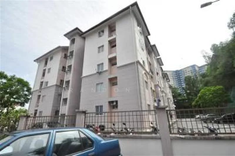 Exterior type: low-rise apartment block; features: white painted facade, grey accent panels, multiple storeys, balconies on upper floors, surrounded by greenery, parking area visible, bicycle parking, street lighting, nearby residential buildings; style: modern.