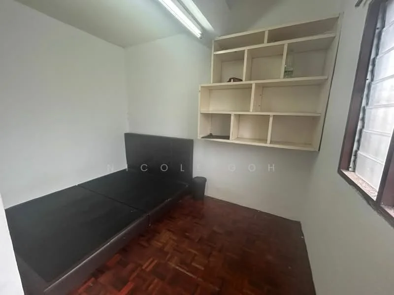 Room features: white painted walls, parquet wood flooring, built-in shelving unit, single bed frame, window with natural light, fluorescent ceiling lights.