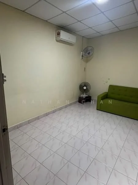 Living features: cream painted walls, white ceiling tiles, ceramic tile flooring, 1 wall-mounted split AC, 1 ceiling fan, green fabric sofa, floor fan.