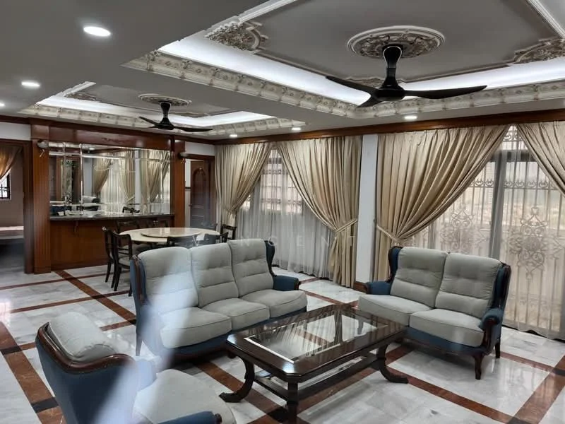 Living features: 3-seater fabric sofa in light grey, 2-seater fabric sofa in light grey, glass coffee table, ceiling with intricate crown moulding, recessed downlights, 5-blade ceiling fan, floor-to-ceiling windows with sheer curtains, marble flooring with brown accent tiles, wooden paneling, decorative wall features; style: luxury. Dining features: round dining table, upholstered dining chairs, wooden cabinetry in background, mirror backsplash, decorative lighting, open layout to living area; style: luxury.
