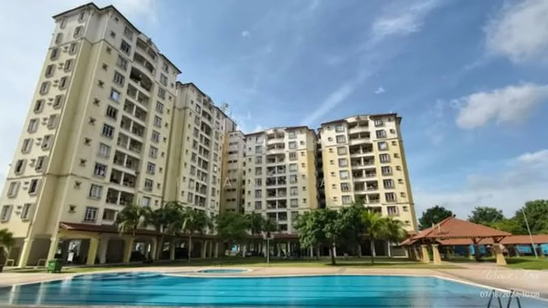 Exterior type: mid-rise condominium; features: yellow painted facade, glass windows, balconies on upper floors, manicured lawn, palm trees, swimming pool in foreground, outdoor pavilion with roof, landscaped garden area, multiple storeys, surrounded by greenery; style: modern.
