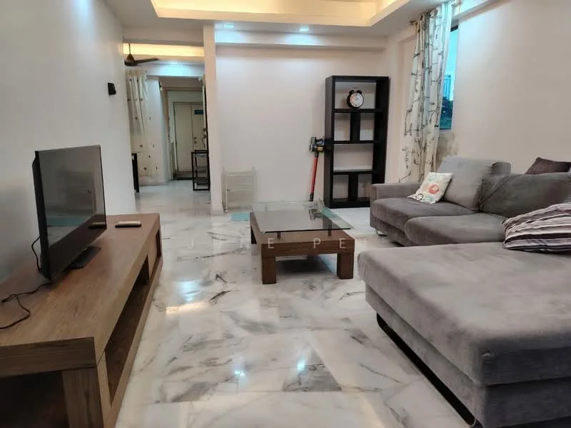 Living features: marble flooring, white painted walls, tray ceiling with recessed lighting, 3-seater fabric sofa in grey, coffee table with glass top, TV console in wood, wall-mounted TV, decorative wall clock, sheer curtains, area rug with geometric pattern; style: modern.
