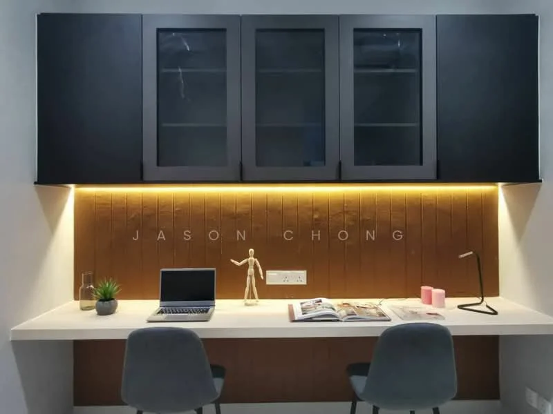 Study features: white desk, black cabinetry with glass doors, wood panel accent wall in brown, LED strip lighting under cabinets, grey upholstered chair, laptop on desk, decorative plant, figurine, magazine on desk, pink candle; style: modern.