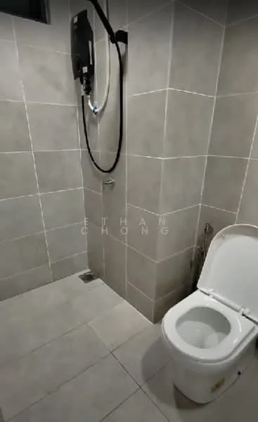 Bathroom features: white toilet, wall-mounted shower head, grey tiled walls, light grey floor tiles, chrome faucet, glass shower partition, drain in floor, towel rack; style: modern.