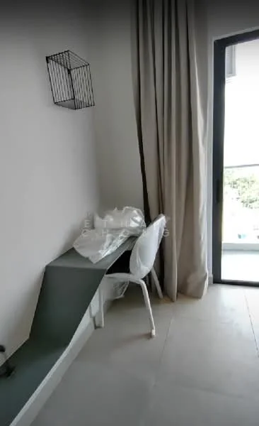 Room features: white painted walls, light-colored flooring, large glass sliding door, curtains, minimalist desk, white chair, wire wall basket, natural light from window; style: modern.