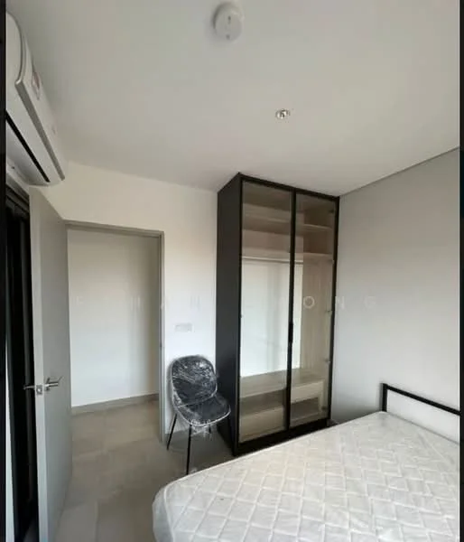 Bedroom features: queen-size bed, built-in wardrobe with glass doors, chair with transparent seat, wall-mounted air conditioning unit, neutral wall color, tile flooring, window with natural light, light fixture on ceiling; style: modern.